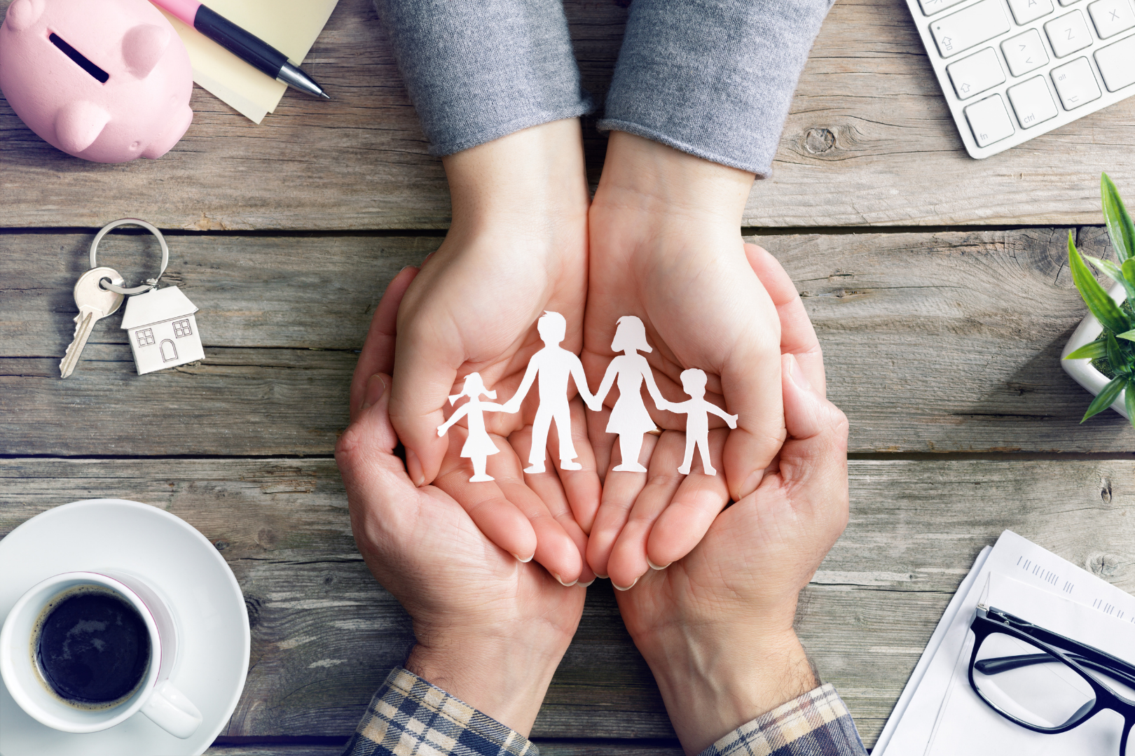 Legal support for families – hands holding paper cut-out family figures, representing family law services by Martin Shepherd Solicitors in Potters Bar, North Finchley, and Hertford.