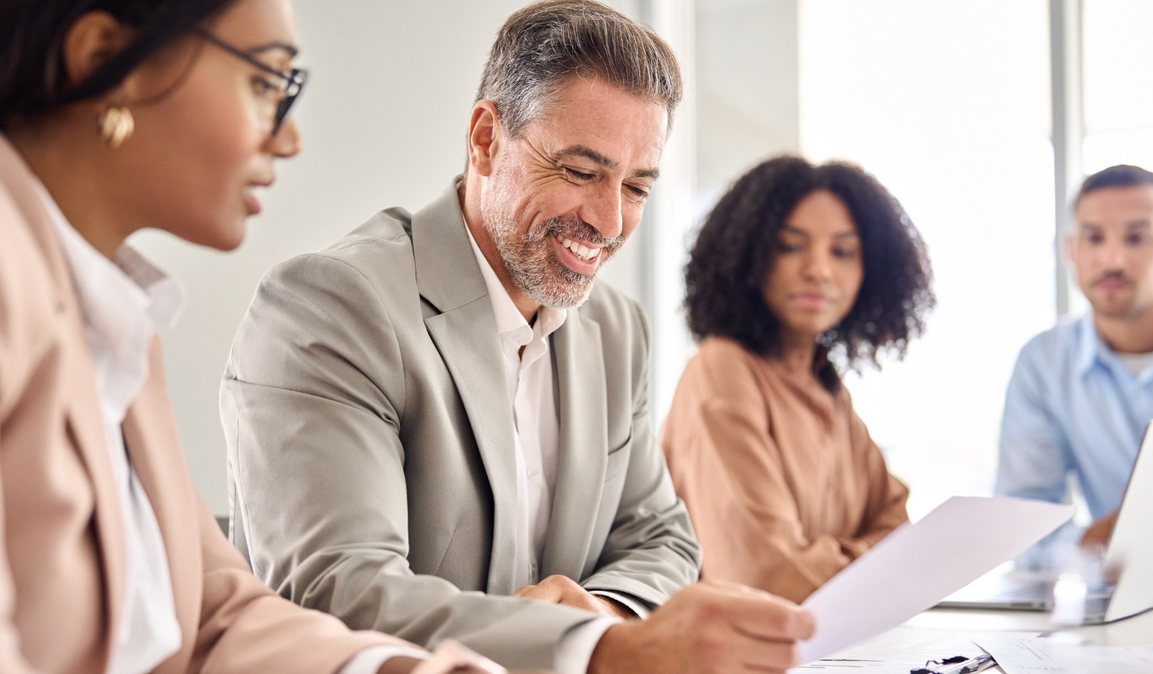 Business meeting with solicitors reviewing documents, symbolising expert business and commercial law advice from Martin Shepherd Solicitors across Potters Bar, Hertford, North Finchley, North London, and Hertfordshire.